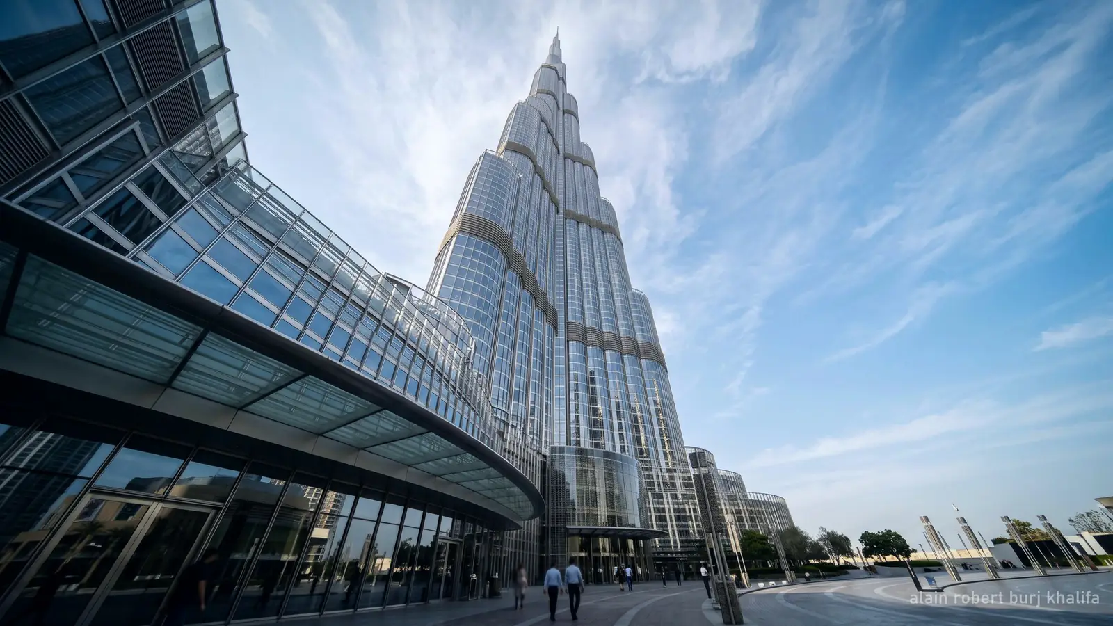 Looking up the near-vertical glass wall of the Burj Khalifa toward its spire (generated illustration)