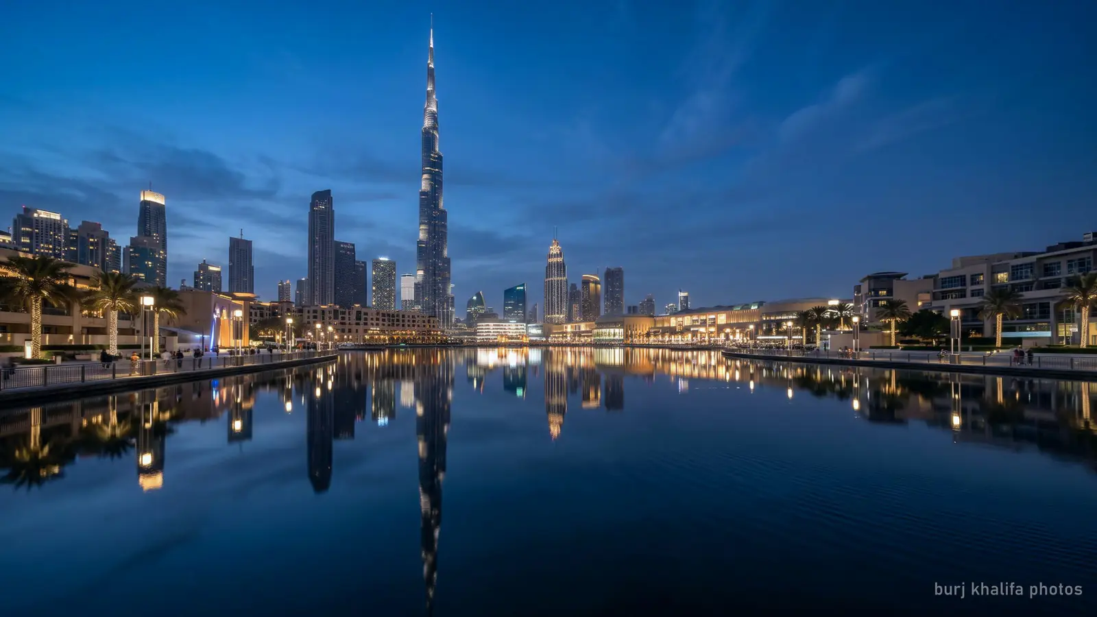 A wide view of the Burj Khalifa reflected in the still water of Burj Lake at blue hour (generated illustration)